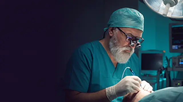 Dr Vekris performing a hair transplant