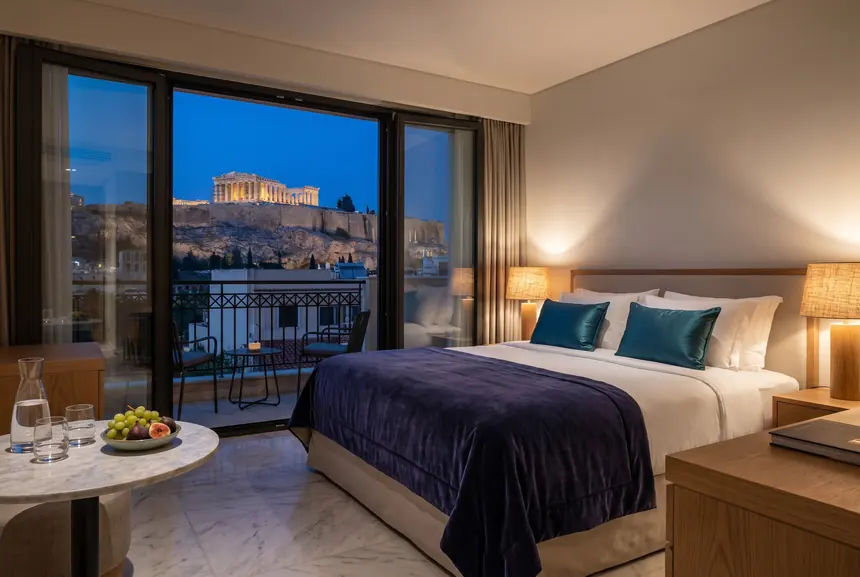 A hotel suite in Athens with a balcony view of the Acropolis